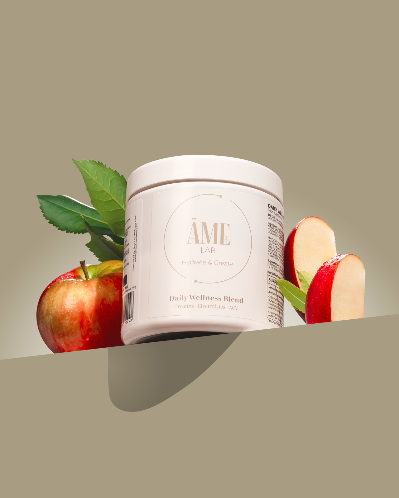 Jar on a ledge with apples and leaves